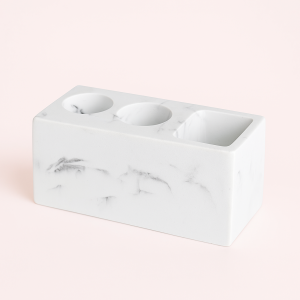 Tandbørste holder i marmor-look og sort - Plastik og metal med glat konstruktion